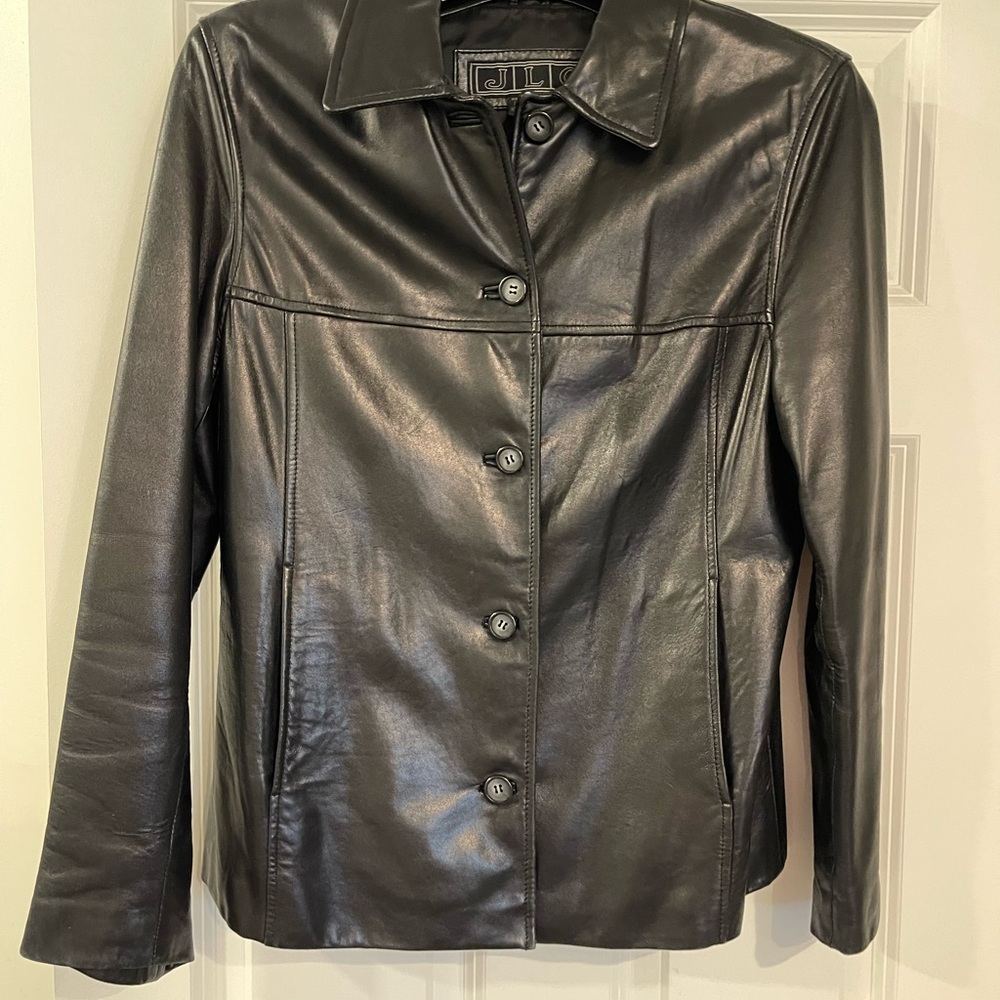 Woman’s, size medium, black leather button down jacket.